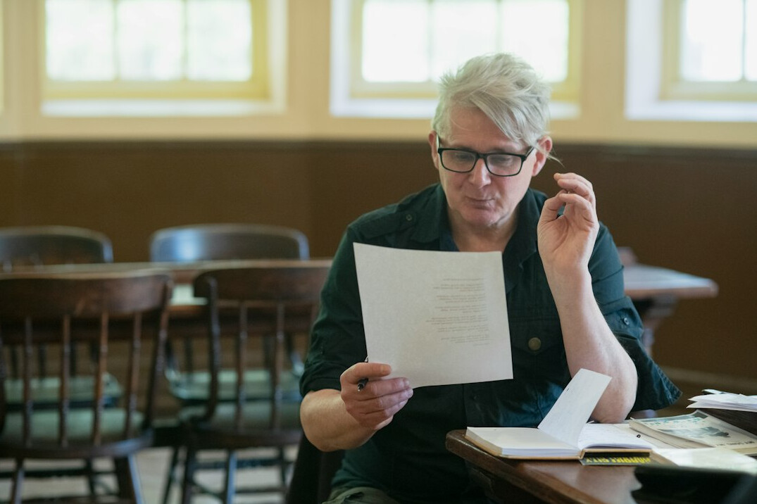 researcher examining documents